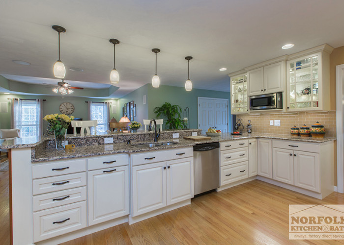 Open linen finish cabinets with pendant lights