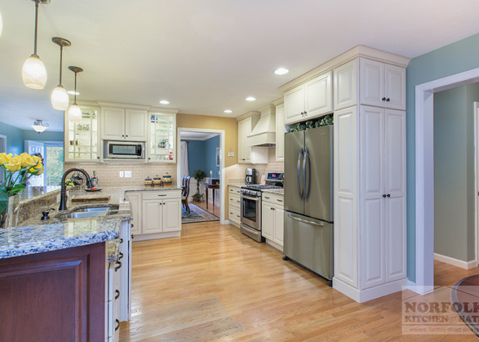 Linen kitchen showing tall cabinet to side of refer