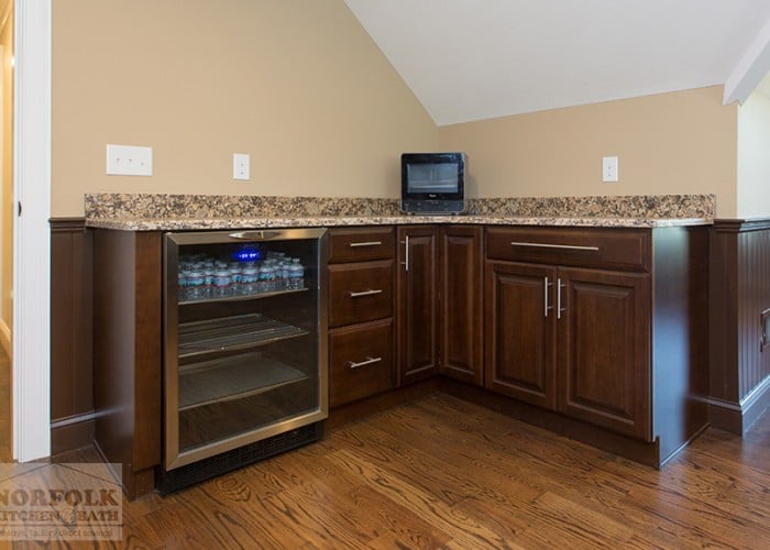 Cherry cabinetry with mini fridge