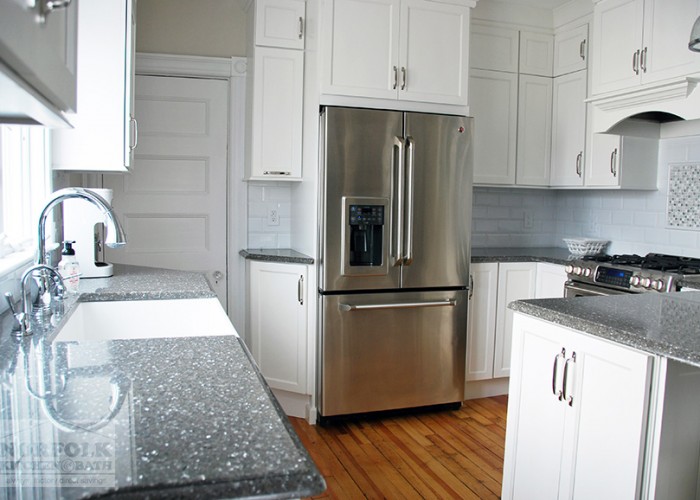 stainless refrigerator in white kitchen 