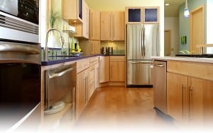 Natural maple kitchen with slab door and stainless appliances