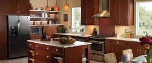 large cherry finish kitchen with island and lots of open shelving