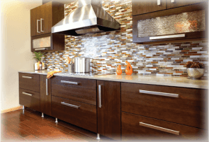 dark colored contemporary kitchen with stainless hood and multi color tile backsplash