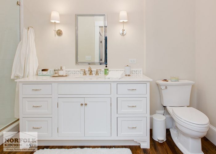 white vanity with inset doors and decorative feet