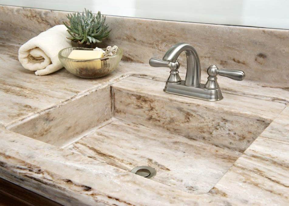 a solid surface vanity countertop with an integrated sink