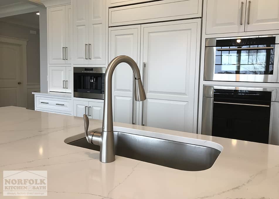 white kitchen cabinets with stainless undermount sink
