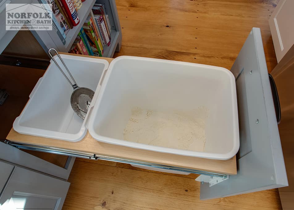 overhead shot of a modified pull out trash cabinet that is used to hold flour