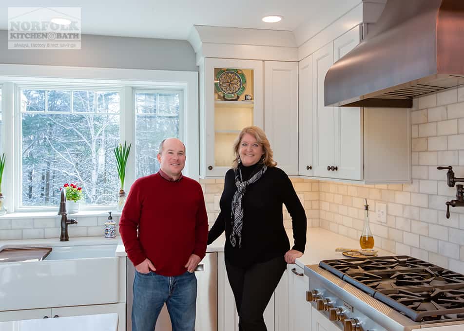 Diane Fleming, a Norfolk Kitchen & Bath designer, posing with one of her contractors, Greg Rehm, in a kitchen they recently completed remodeling.
