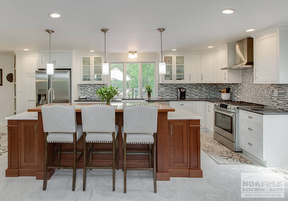 classy white kitchen with glass doors and all wood island and 3 decorative stools