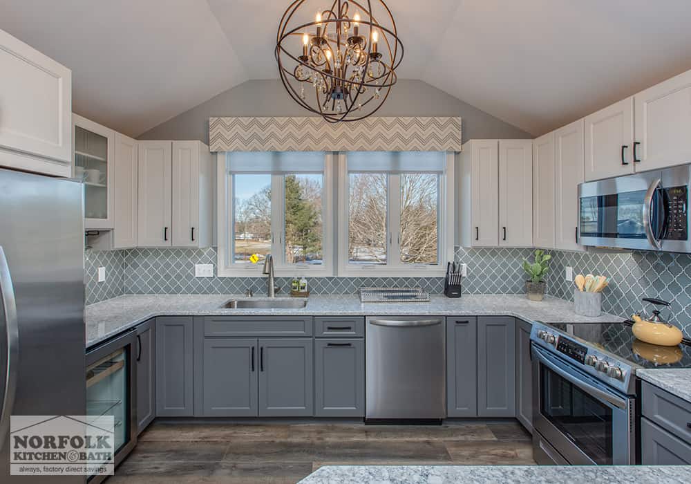 grey kitchen with white wall cabinets