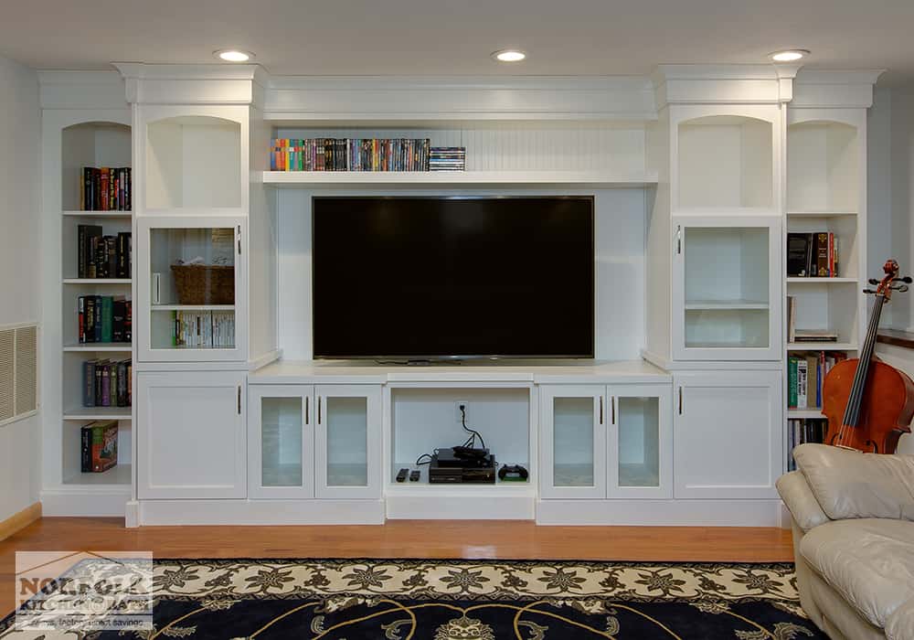 white cabinet entertainment center with built in bookshelves