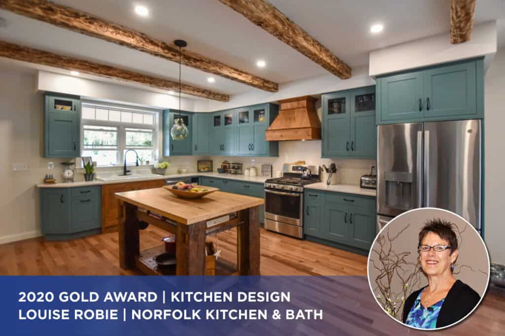 a teal kitchen with wood accent pieces and a small wood island, designed by Louise Robie, a 2020 Cornerstone Award Winner