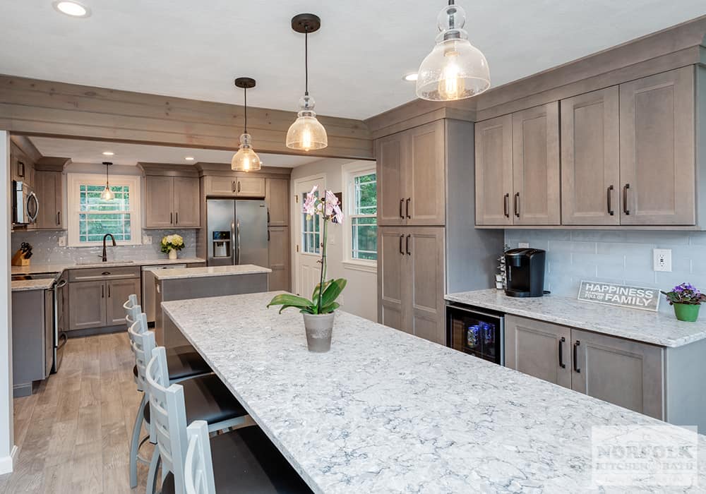 large Wilmington kitchen remodel with gray stained cabinets, two islands and white stone countertops