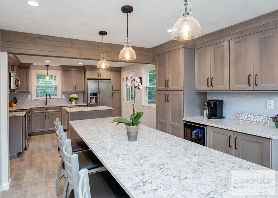 large Wilmington kitchen remodel with gray stained cabinets, two islands and white stone countertops