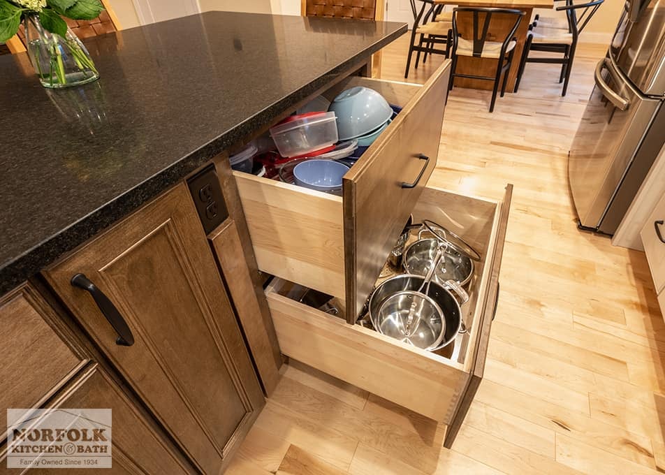 stained wood cabinets with extra deep drawers and a dark stone countertop in a Hudson, NH kitchen remodel