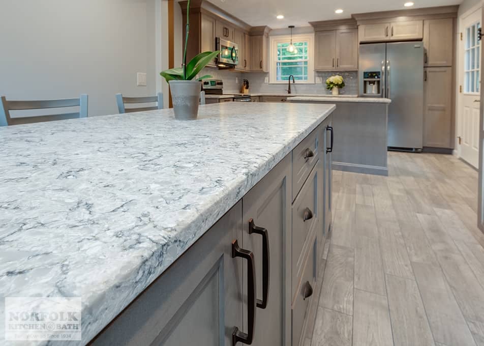close up of a white stone kitchen countertop on gray stained kitchen cabinets in Wilmington