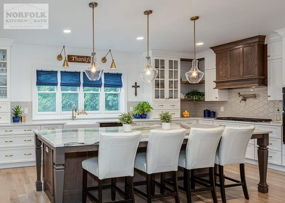 two-tone large white kitchen cabinets with oak accent hood and kitchen island