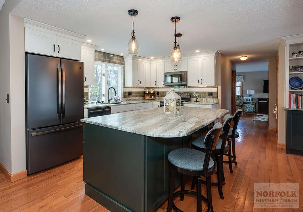 white cabinets with a green island in a kitchen remodel in Nashua NH