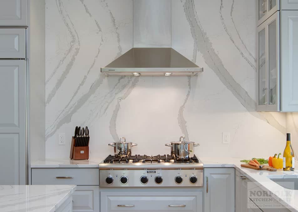 gray kitchen with full-height quartz backsplash