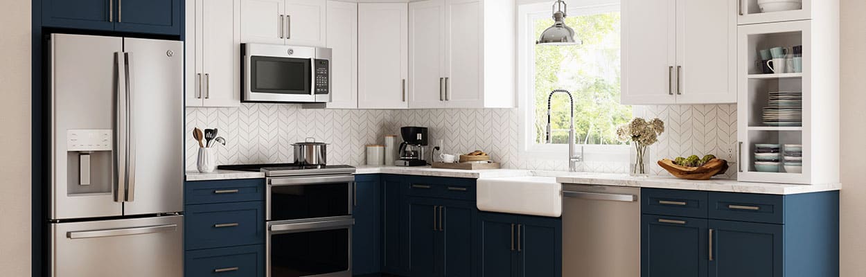 norfolk custom kitchen design with blue and white shaker cabinets and quartz countertops