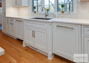white shaker cabinets with decorative molding