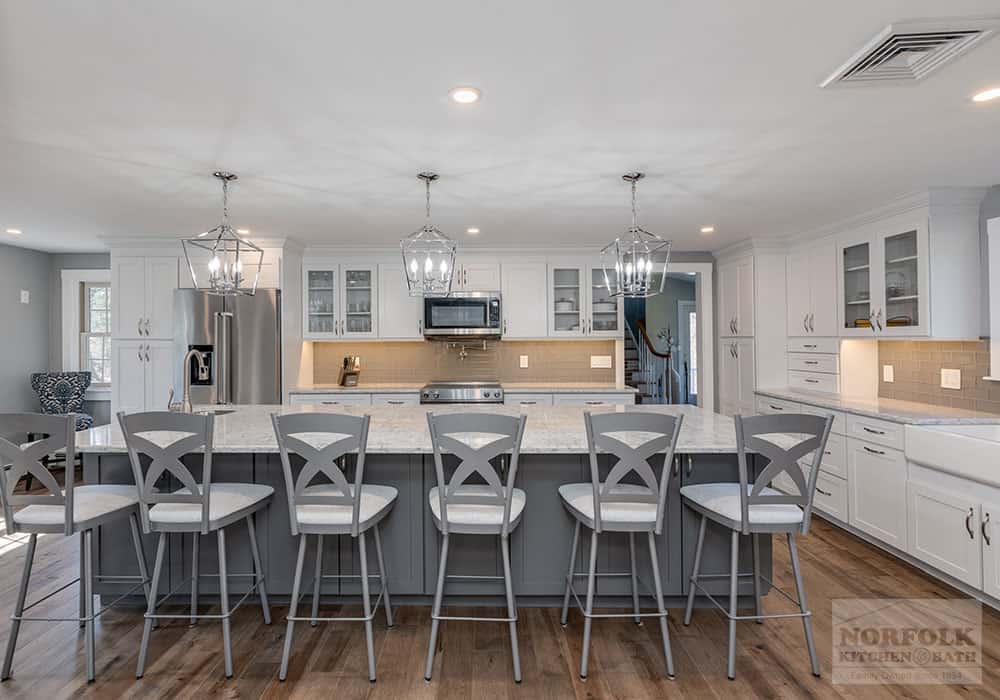 white kitchen remodel with a large 6-seat gray island