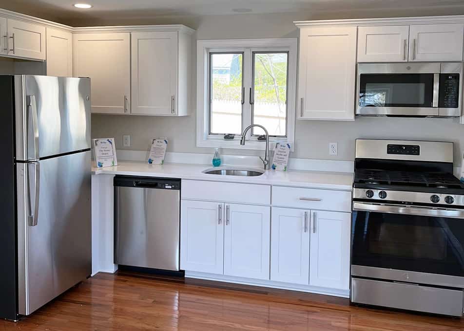 white shaker kitchen in habitat for humanity home in westwood, massachusetts